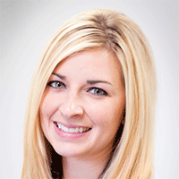Headshot of a blonde businesswoman smiling