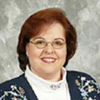Headshot of a redheaded businesswoman smiling