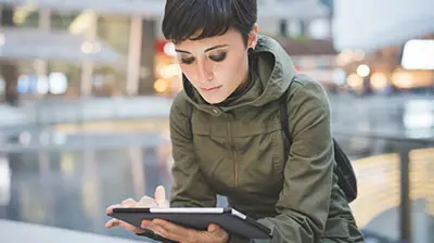 A young woman working on a tablet